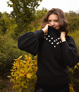 Model in black cashmere sweater